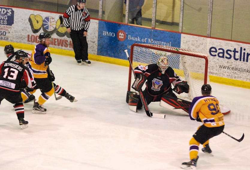 Caribous’ goalie Jason Churchill makes a save in his first home weekend appearance this season.