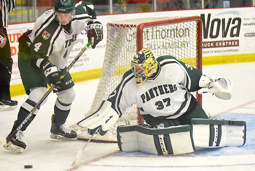 UPEI Panthers goaltender Simon Hofley steers the puck to defenceman Andrew Picco during the second period of an Atlantic University Sport exhibition game against the Saint Mary’s Huskies on Wednesday in Truro, N.S.