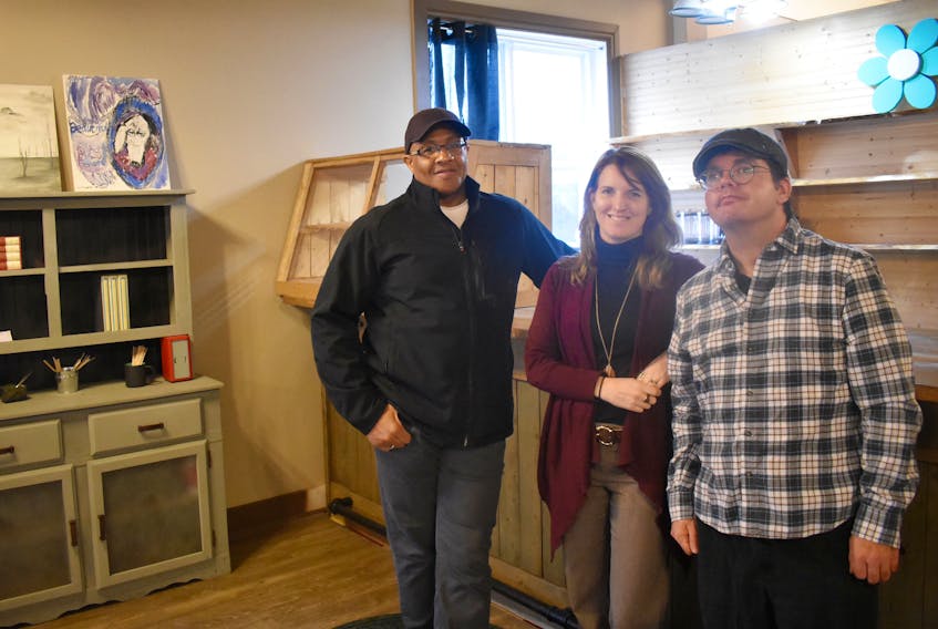 Riverview Home Corporation staff member, Dana Lee, Social Enterprise Coordinator, Jocelyn Tye and resident Timothy MacDonald standing inside a new cafe opened by the local non-profit right in downtown New Glasgow. The new cafe, which will be open sometime in March, will be called The River Run Cafe.