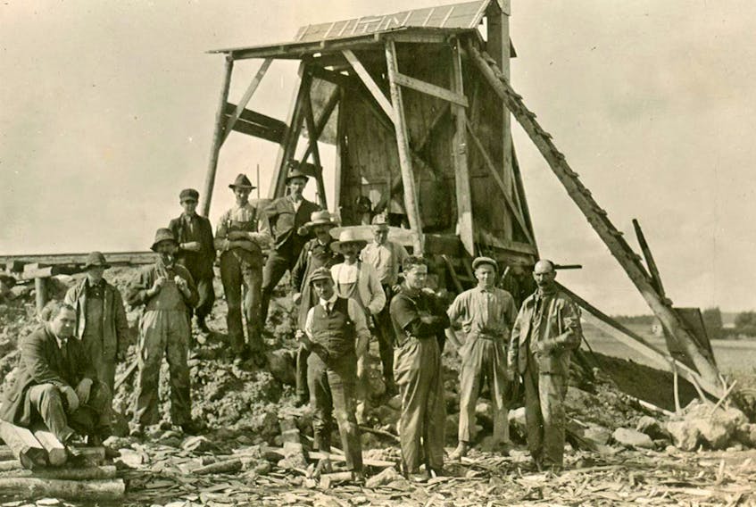 This is the first head frame at Malagash Salt Mine. Engineer Bob Chambers of New Glasgow is extreme left, sitting.