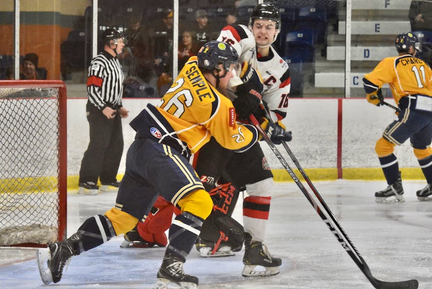 Jake Martin of the Pictou County Crushers battles with Ryan Semple of the Yarmouth Mariners on Jan. 3.
