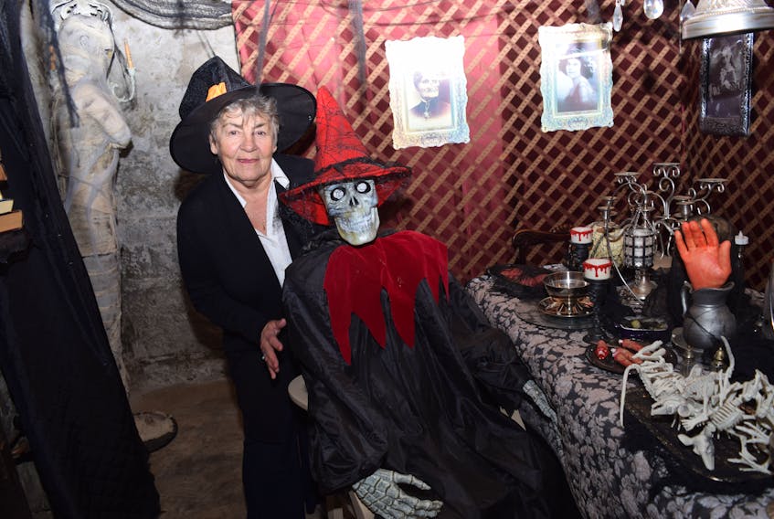 Beverly Underwood greets an old acquaintance inside the Witches Den.