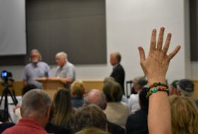 A hand raised during the Q&A portion of a Lyme Disease Awareness Event held at the Pictou County Wellness Centre on Sept. 6