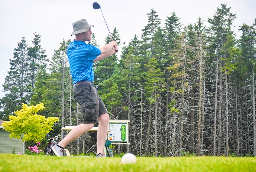 Keighan Rauh hits off the 10th tee on July12, as part of the annual Trenton FunFest golf tournament.