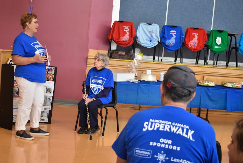 Margaret Milne speaks during the opening for this year’s SuperWalk in Pictou County. Seated is Josephine Jollymore, who was recognized as the winner of this year’s Parkinson SuperWalk National Hero for her contributions.