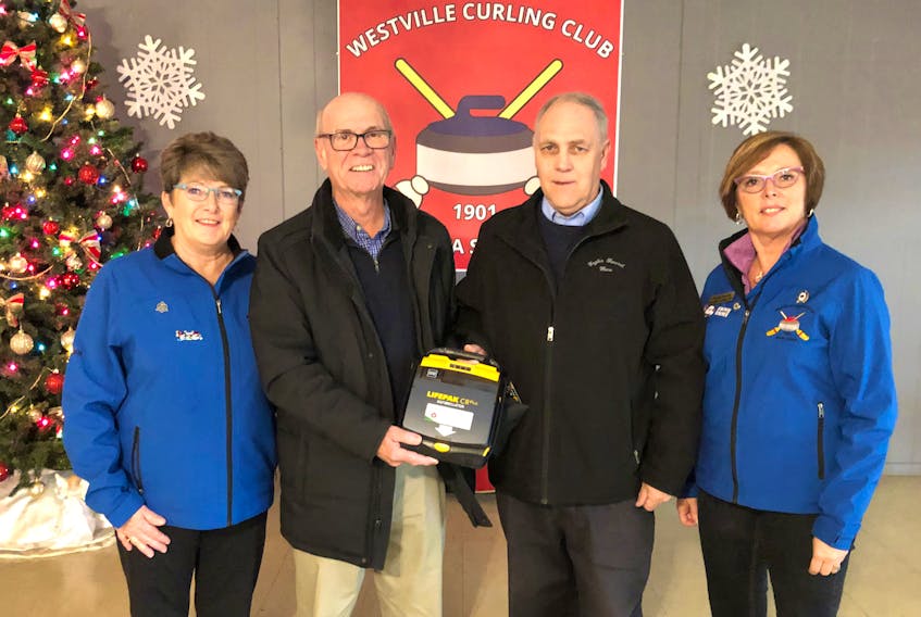 From left, club president Dawn Fraser; Lennie White, Westville Rotary Club; Art Eagles, Eagles Funeral Home and club treasurer, Bonnie Coulter.