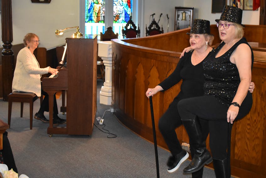 June Rigden plays the piano while Eleanor Hall and Jennifer Eames rehearse for the upcoming Broadway and Beyond concert.