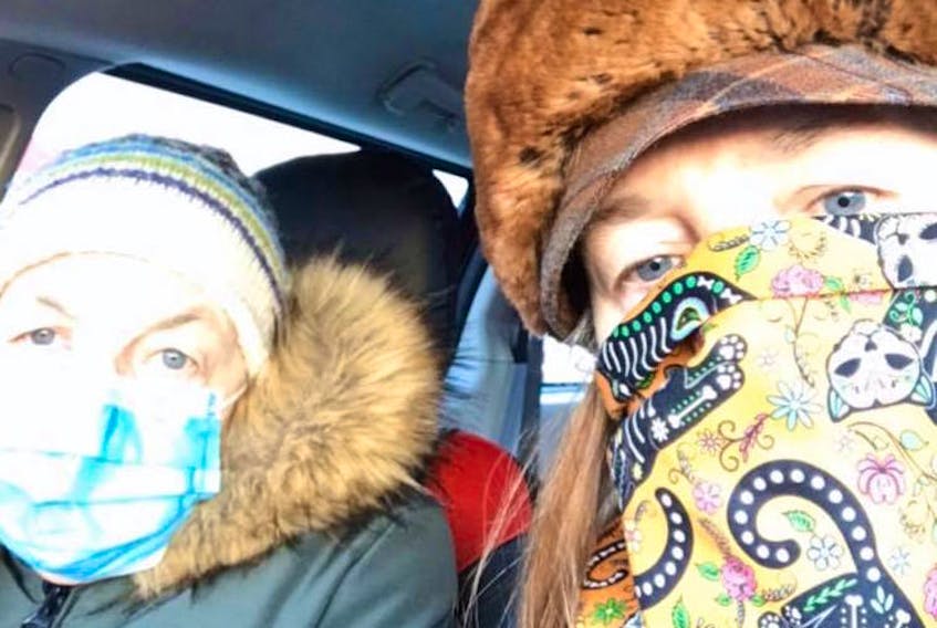 Elda Rumsay and Carin Goldsberry on a drive into town. Since posting this photo Goldsberry has made and given away 300 face-covers to the community.