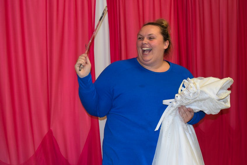 Erika Sloan holds a dress she found at the trunk sale hosted at Summer Street Industries on Oct. 19.