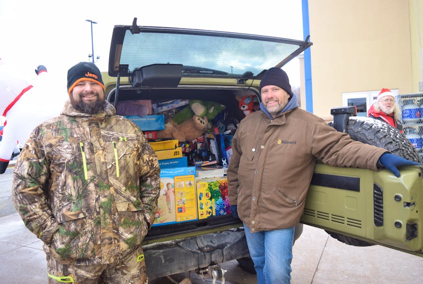 Dave Webber, left, and Leonard Mallett, from the North Nova chapter of the Nova Scotia Jeep Club, are hoping to see two jeeps filled with toys by this weekend.