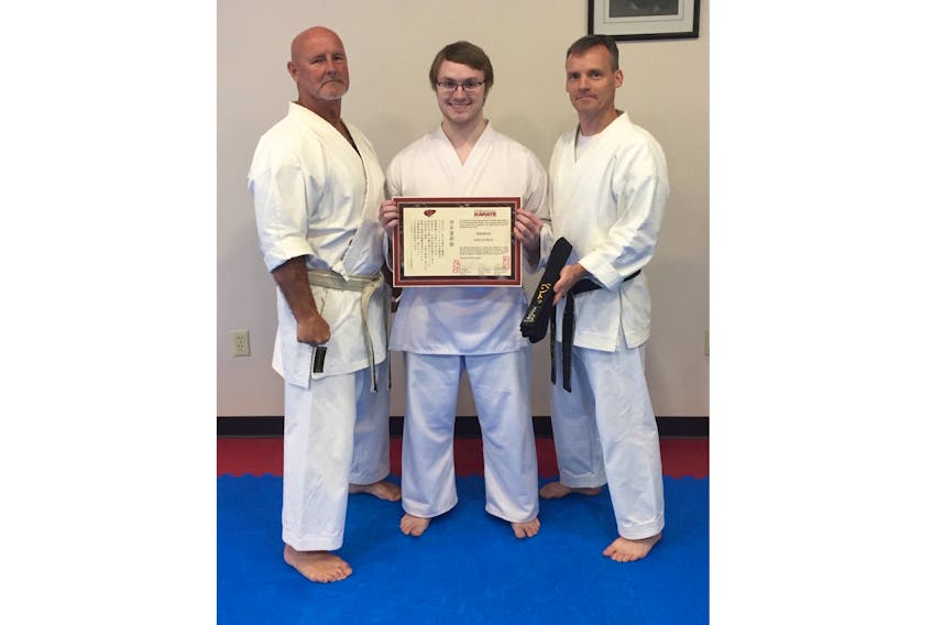 Gaelen Bent of Trenton (middle), with Sensei Ron Fagan (left) and Sensei Chris Cruikshank (right) received his 1st Degree black belt on Aug. 25.