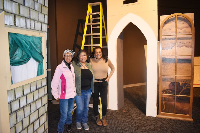 Bernice Byers-Arsenault, Juanita Peters and Angel Gannon were helping set up an exhibit at the Museum of Industry in Stellarton which tells about the community of Africville.