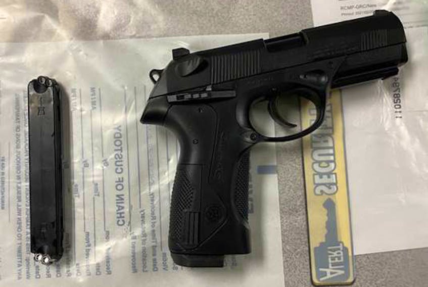 An 81-year-old is accused of threatening two women with this Black Berretta pellet handgun. POLICE PHOTO