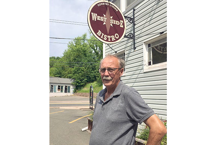 Phillip Castle outside the New Glasgow bistro he owns with his wife Darlene. It is scheduled to close Aug. 29. -