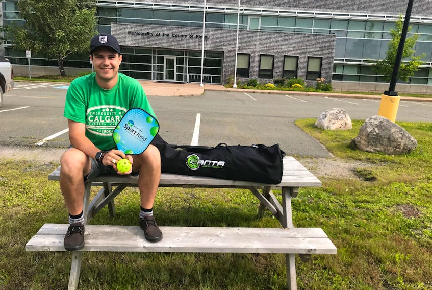 Joel MacNeil, a MOPC recreation student, holds up one of the pickleball sets available for loan from the municipality’s recreation department.  Residents or community groups interested in trying out the popular sport are encouraged to contact the MOPC recreation office for more details.