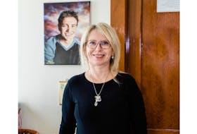 Dianne Young, the founder and director of Lennon House in Rustico, poses in front of a photo of her late son Lennon Waterman. Young started the long process of opening a recovery home for people struggling with addictions after her son took his life in late 2013.
