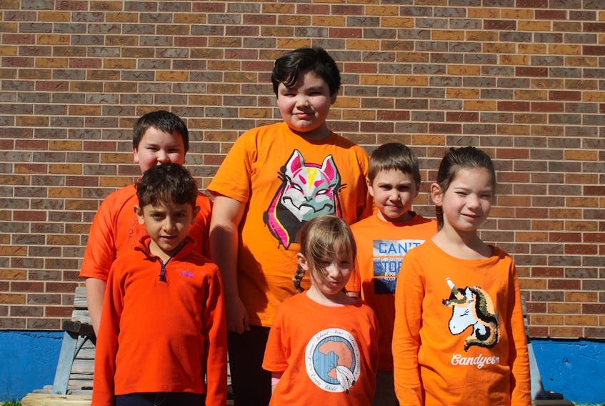 Children at Prince Street School are decked out for Orange Shirt Day Monday, where they learned about residential schools and Indigenous survivors. Back, from left, are Landon Saunders (Grade 3), Mason Larkin (Grade 6) and Fletcher Gallant (Grade 3), while front, from left, are Nidal Habash (Grade 1), Talia Blackett-Labobe (kindergarten) and Phoenix Labobe (Grade 1).