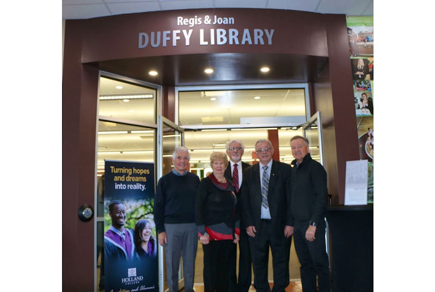 Mike O’Brien, left, chairman of the Holland College board of governors, Joan Duffy, Sandy MacDonald, Holland College president, Regis Duffy and Ron Keefe, chairman of the Holland College Foundation board of directors, prepare to enter the Regis & Joan Duffy Library on the Prince of Wales Campus.