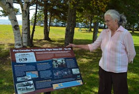 Aggi-Rose Reddin looks at an interpretive panel unveiled at Tea Hill Park in Stratford on Wednesday, commemorating the park’s connection to the first Canadian transatlantic flight.