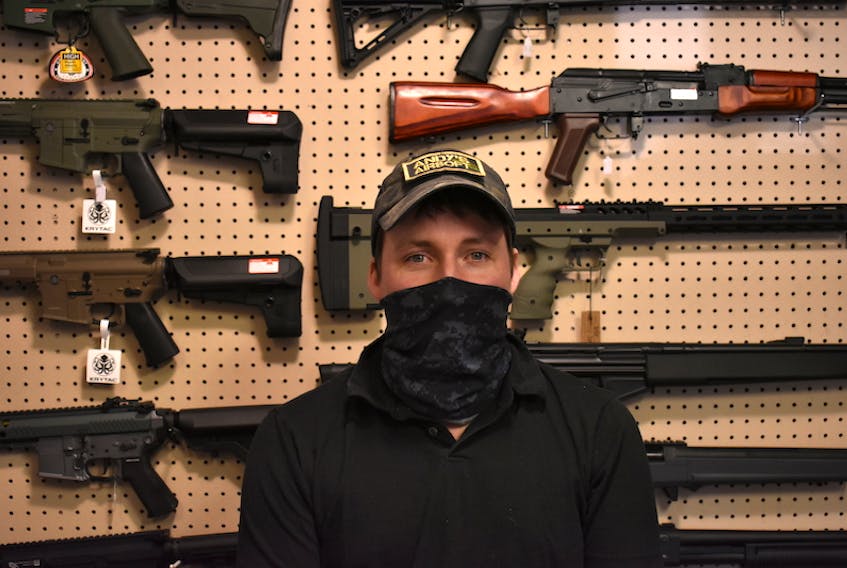 Andy Hardy, owner of Andy's Airsoft in Charlottetown, stands in front of a display of some of the airsoft guns he sells. If Bill C-21 were to become law, they would all be illegal for Hardy to sell, effectively ending his business.