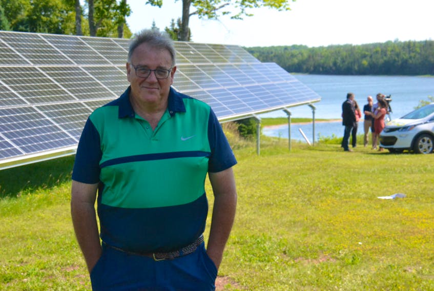 Mark Booth at his home in Belle River. The homeowner decided to install solar panels at his home to lower his energy costs.