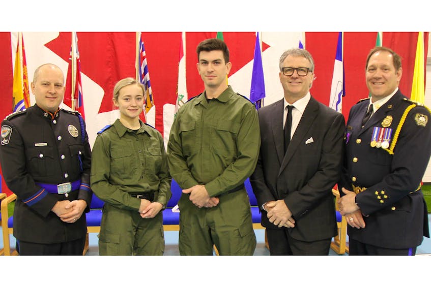Students in the 18-week conservation enforcement program are shown at their ceremony at the Atlantic Police Academy in Slemon Park recently. Guest speaker Jason McGinn, left, director, Department of Fisheries and Land Resources, government of Newfoundland and Labrador, is shown with Kendra Rioux, student speaker, graduating student Jordan Allen, Doug Currie, Holland College vice-president, corporate services, and Forrest Spencer, executive director, Atlantic Police Academy.