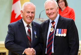 James Casey, left, receives his Meritorious Service Medal from then Gov. Gen. David Johnston in 2015. On Dec. 31, 2020, Casey was appointed to the Order of Canada.