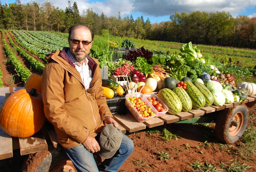 Aman Sedighi displays some of the vast variety of fruits, vegetables and herbs grown on his farm in Brookfield. In 2014, Sedighi brought his family to P.E.I. from Syria, where he was an agricultural researcher with the government.