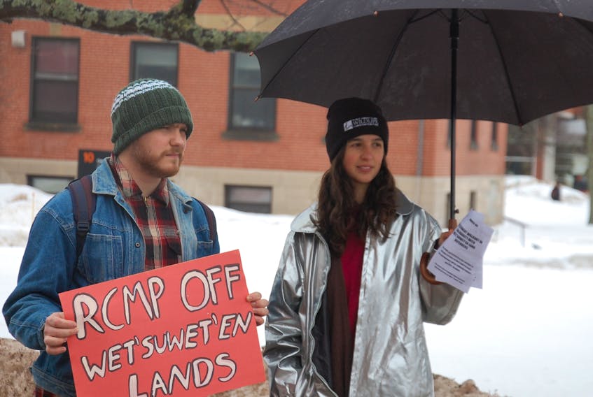 Fourth-year UPEI students Ian Soloman and Indra Johnson took part in a student walkout Wednesday on the university campus to show solidarity with Wet'suwet'en land defenders. Students from the University of Victoria organized the walkout in support of Wet’suwet’en hereditary chiefs who oppose a pipeline being built through northern B.C. Organizers expected dozens of other Canadian universities and high schools to join in demonstrating. Johnson was handing out pamphlets that detailed the purpose of the walkout. "As students attending the University of Prince Edward Island, it is crucicial for us to recognize that we exist on the unceded territory of Mi'km'qi,'' the pamphlets states in part. "In doing so, we give respect and awareness to the historical ongoing struggle of indigenous peoples against the violent colonial acts of the Canadian state.''