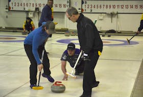 Tyler Smith, third with the Eddie MacKenzie rink, releases a shot while lead Ryan Lowery, left, and second Sean Ledgerwood handle the sweeping. The action took place during the Tankard P.E.I. men’s curling championship in O’Leary in January. Team MacKenzie defeated the Blair Jay rink from the Silver Fox in Summerside 3-0 to win the best-of-five series and earn P.E.I.’s berth in the Tim Hortons Brier Canadian men’s curling championship in Calgary, March 6-14.