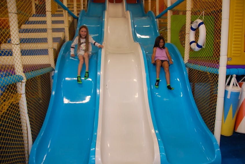 Serenity O'Brien, 6, of Miscouche, left, and her friend Mya Doucette, 7, of Summerside enjoy a recent outing at Off The Wallz in Summerside. The fun park has only been running at about 10 per cent capacity since re-opening in mid-July.