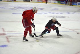 Summerside Western Capitals’ sophomore forward Colby MacArthur, left, makes a pass while being defended by rookie defenceman Sid McNeill, during a practice drill at Eastlink Arena recently. MacArthur and McNeill are Summerside natives. The Capitals open the 2020-21 Maritime Junior Hockey League regular season at Eastlink Arena against the Valley Wildcats on Saturday, Nov. 7. The opening faceoff is 7 p.m.