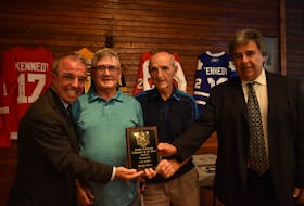 Ricky Burns, second from left, receives the inaugural Forbes Kennedy volunteer of the year award for contributions to P.E.I. sports, particularly five-pin bowling. With him, from left, Charlottetown Mayor Philip Brown, Forbes Kennedy and Charlottetown Coun. Mitch Tweel.