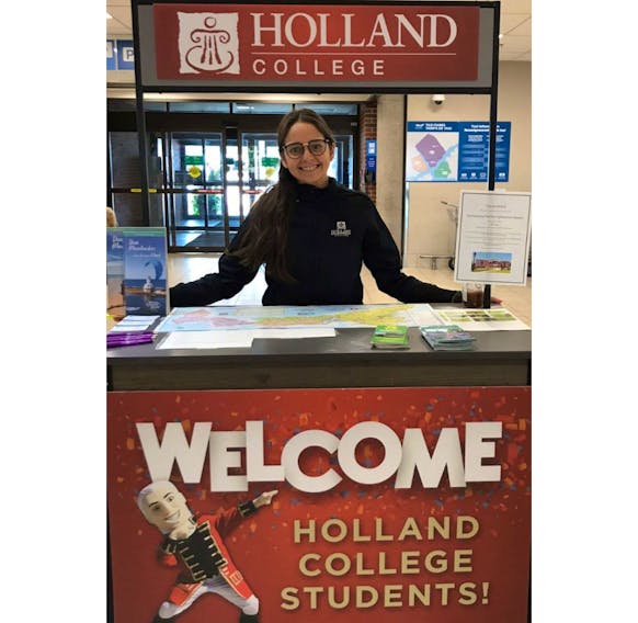 Grecia Frangos Perez, international student co-ordinator for Holland College, prepares to greet new students at the Charlottetown Airport.