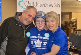 Kara MacRae, centre, of Orwell is one of the 1,100 children whose wishes were granted by the Children’s Wish Foundation of Canada this past year. On Thursday, the national organization announced it is merging with Make A Wish Canada. Also pictured are Kara’s parents, Donnie MacRae and Violet Robinson.