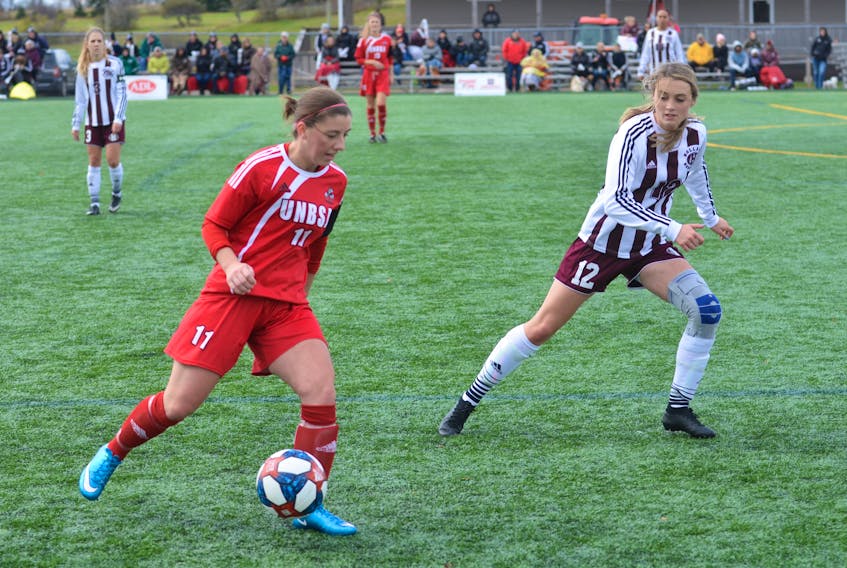 Rachel Green, 12, of the Holland Hurricanes defends against the UNBSJ Seawolves’ Hannah Ranni during a semifinal game of the Atlantic Collegiate Athletic Association (ACAA) women’s soccer championship at the Terry Fox Sports Complex in Cornwall on Oct. 26. The Hurricanes would go on to defeat the St. Thomas Tommies 3-2 in the final the following day to advance to this week’s Canadian Collegiate Athletic Association (CCAA) women’s soccer championship in Edmonton.