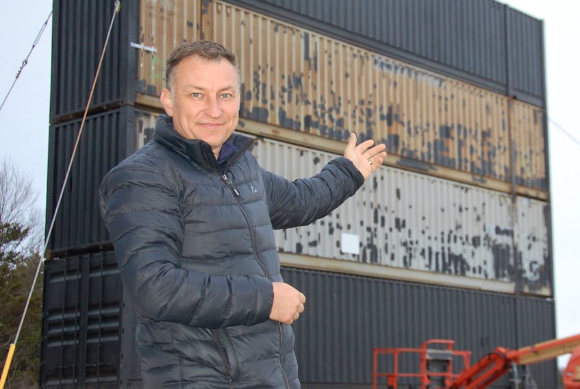 Bob Boyle, owner of the Brackley Drive-In Theatre, points to the railway containers stacked four stories high for a second movie screen at the long-running outdoor movie venue. Boyle expects movies to be playing on the second big screen by June.