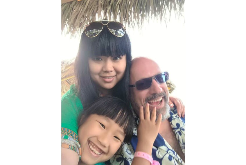 Monte Gisborne of Montague is pictured with his wife and step-daughter on vacation in 2018. At the moment, his wife, Daniela, and step-daughter Dominica are healthy but trapped in Wuhan where the coronavirus has killed nearly 500 people and infected more than 24,000 others. Submitted