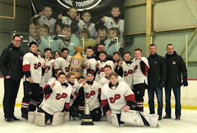 The Pownal Red Devils defeated the North West Bulls from New Brunswick 5-2 in the championship game of the Edd McNeill Memorial hockey tournament at The Plex in Slemon Park recently. A record 12 peewee AAA teams from across the Maritimes took part. Members of the Red Devils are, front row, from left: Hudson Bradley, Aiden Murnaghan, Beckett McCabe, Ethan Hansen, Brody Molloy, Aiden Wilson and Alex Curran. Back row: Gordie Walsh (head coach), Jeffery Guo, Brae Johnston, Jacob Denomme, Ethan Anderson, Alexander Keus, Kayden McGuigan, Shane Ostridge (manager), Ryan Dwyer, Rowan Walsh, Jackson Batchilder, Nate Ostridge, Tyson Bradley (assistant coach) and Jason Denomme (assistant coach).