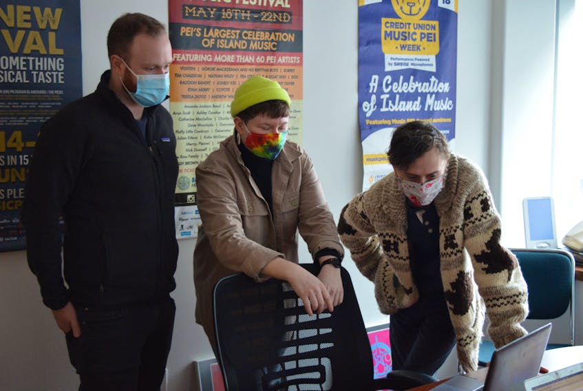 Officials at Music P.E.I. were working Friday on the rescheduled list of events for Credit Union Music P.E.I. Week, March 26-28. From left, are Steve Love, program manager with Music P.E.I., along with Andy Glydon and Dylan Menzie, event co-ordinators.