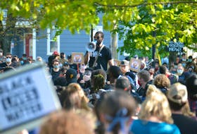 Daniel Ohaegbu speaks at a Black Lives Matter rally in Charlottetown on Friday. Ohaegbu said the frequency of violence against black men and women in North America by police happens too often to be "just a few bad apples".