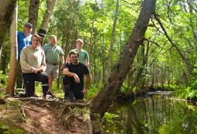Roseville/Miminegash  Watersheds Inc. co-ordinator Danny Murphy, left, is joined by his team, daughter and staff member Carrie-Jane Murphy, board member Dennis Rix, summer students Daniel Gavin and Jacob Delaney at the edge of the Miminegash River.