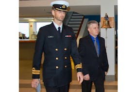 Todd Bannister, right, heads into military court Tuesday with his defence lawyer Lt.-Cmdr. Brent Walden.