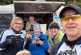Cynthia King, inside the trailer, serves a number of customers at her Brookvale Cafe, Bits Bikes Brews. The customers are, from left, Shelly Danks Bradley, Wendy Toy, Andrea Deveau and Ryan Bradley.