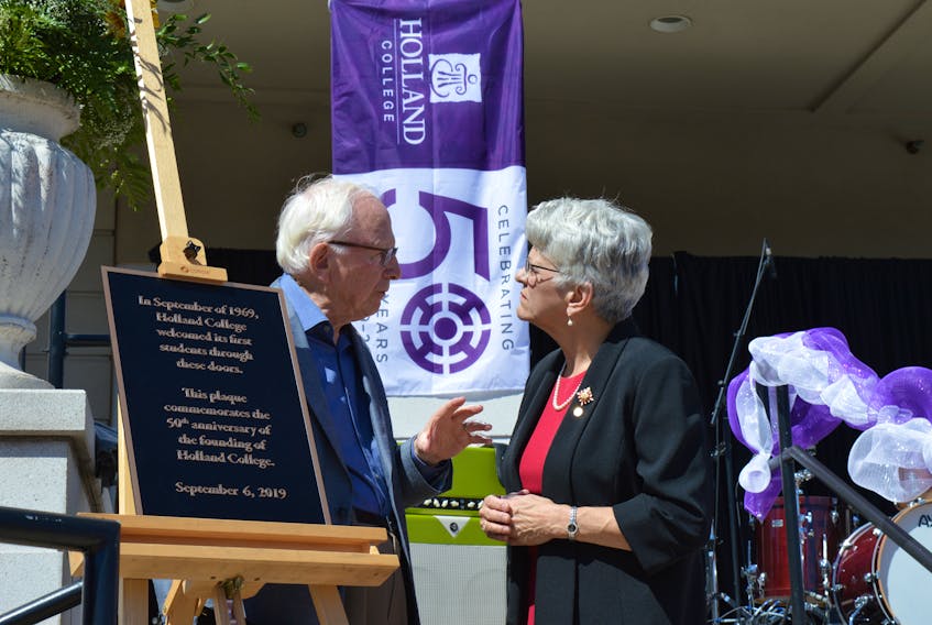 Donald Glendenning, first president of Holland College, chats with Lt.-Gov. Antoinette Perry at the unveiling of a plaque commemorating the 50th anniversary of Holland College.