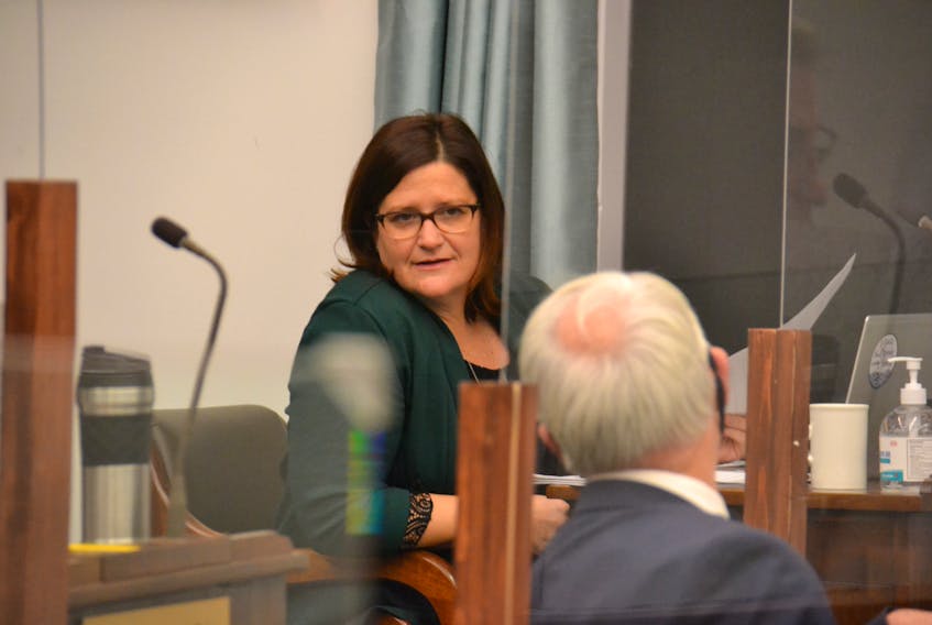Green Education critic Karla Bernard speaks to Opposition Leader Peter Bevan-Baker before a sitting of the legislature. On Friday, Bernard raised questions about vacancies within the student wellbeing teams, which provide supports for youth in P.E.I. schools.