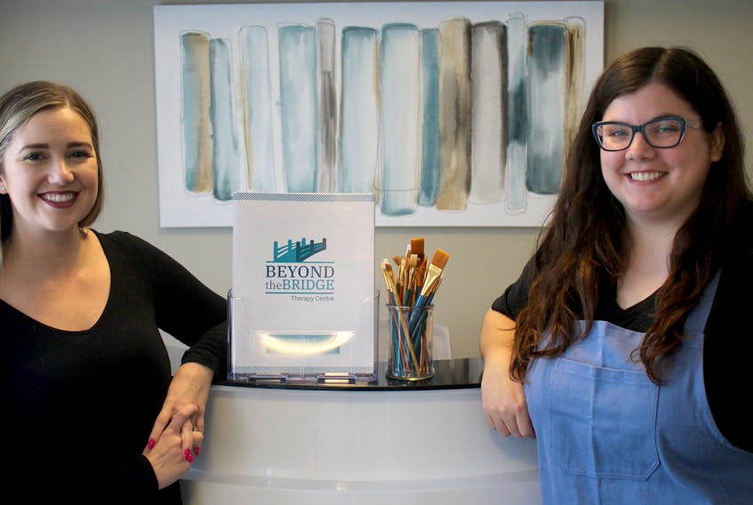 Stephanie Dawson and Katie Murray put the finishing touches on their new business, Beyond the Bridge Therapy Centre on Walker Avenue in Summerside. The new centre will provide therapy and art therapy services to Island residents.