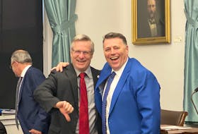 Liberal MLA Robert Henderson and Premier Dennis King joke around prior to question period at the P.E.I. legislature in November 2019.
