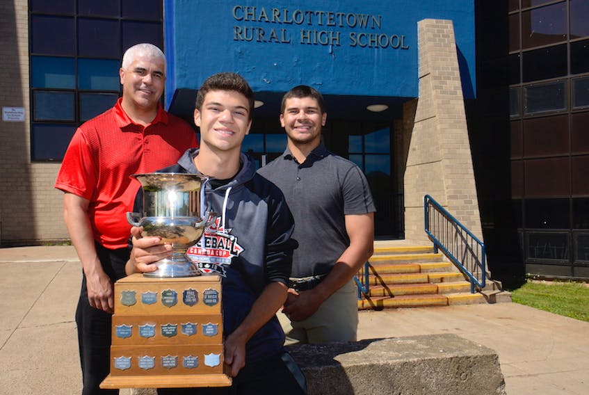 Nolan Ryan, centre, is the third member of his family to win the male athlete of the year award at Charlottetown Rural High School. Ryan is flanked by his father Joe, left, and his older brother, Dominique.