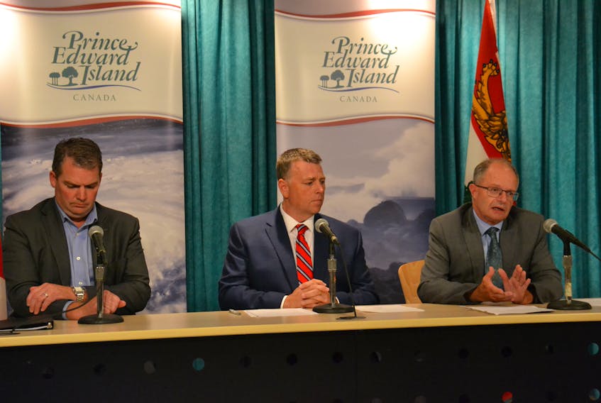 Social Development and Housing Minister Ernie Hudson, right, speaks at a briefing, alongside Public Safety Minister Bloyce Thompson, left, and Premier Dennis King on Monday. The province has requested funding assistance from the federal government to help municipalities, businesses and individuals who have incurred expenses related to Hurricane Dorian.